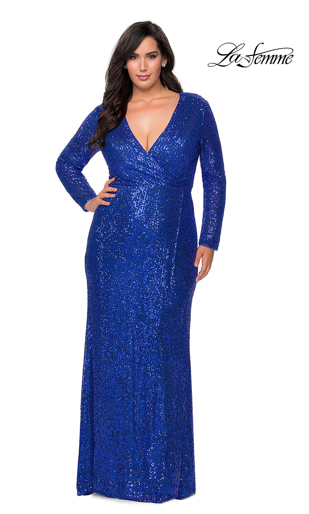 A woman wears the Sequin Plus-Size Long Sleeve La Femme Prom Dress in royal blue with a floor-length design and deep V-neckline. The